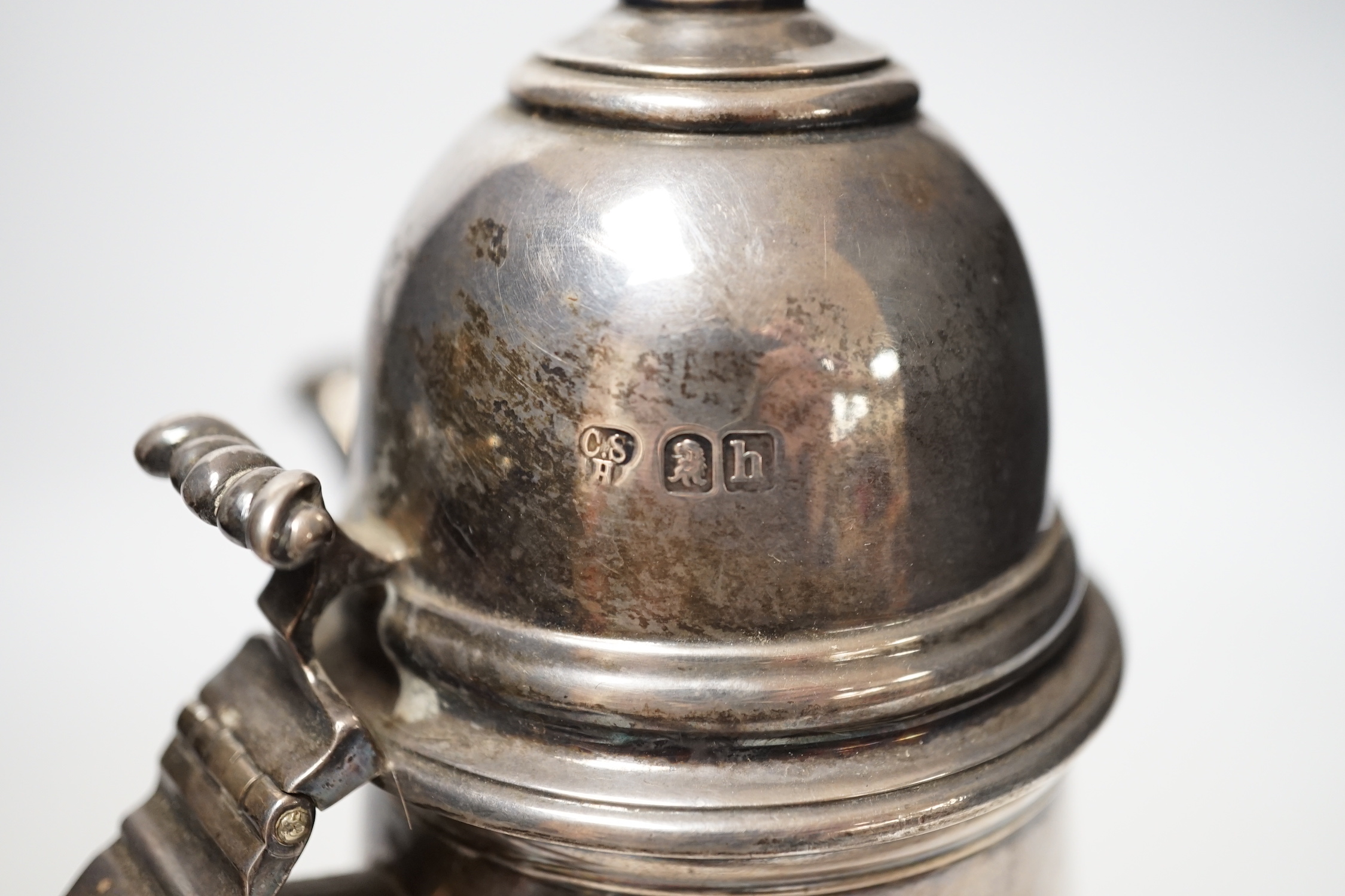 An Edwardian Queen Anne style Brittania standard silver cafe au lait pot by Charles Stuart Harris, London, 1903, height 23.5cm, gross weight 18.9oz.